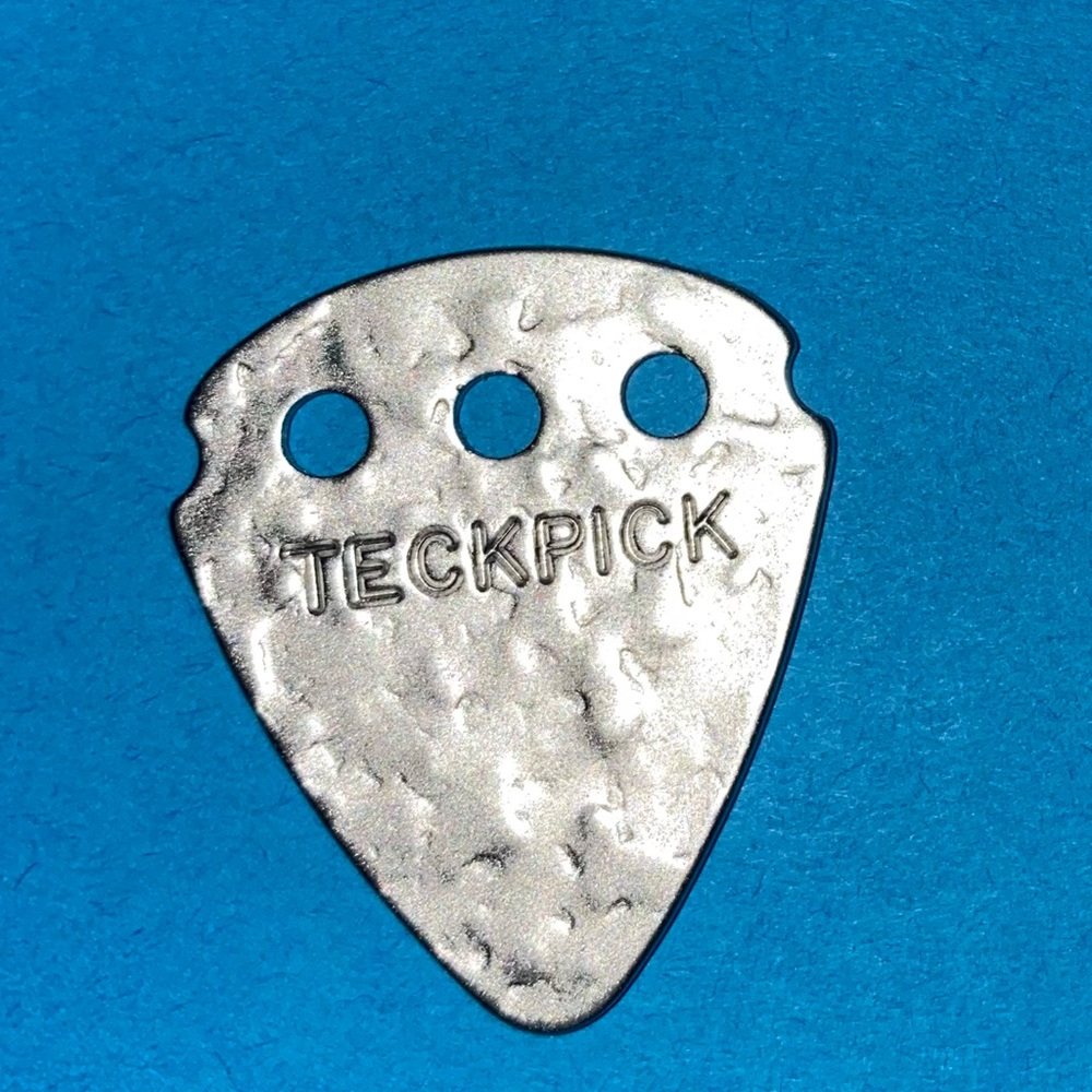 A pair of Teckpick Silver Guitar Pick